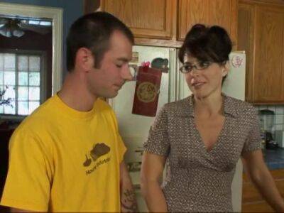 Lusty brunette milf in glasses seduced man next door on her kitchen counter - sunporno.com